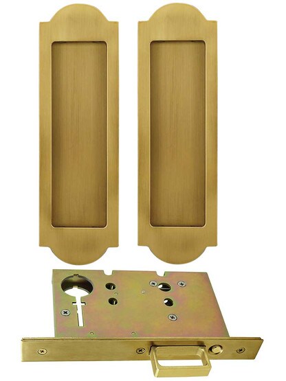 Premium Pocket-Door Mortise Lock Set with Arched Pulls in Aged Brass.